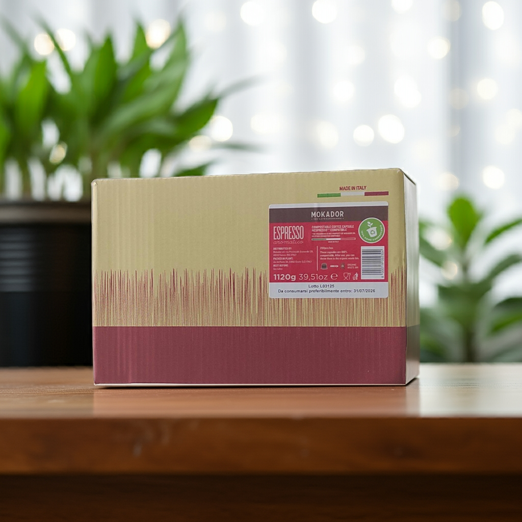 Compostable capsules box with a label on a wooden surface with plants in the background
