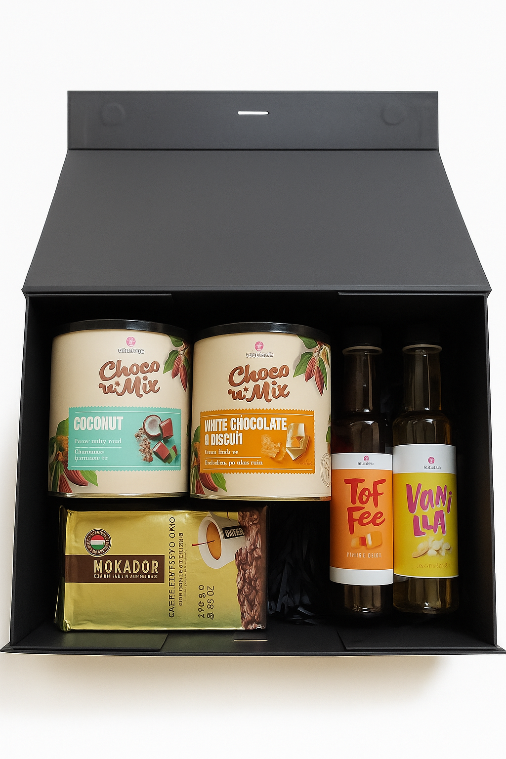 Black gift box with palm oil free drinking chocolate, ground coffee, sustainable products on a white background