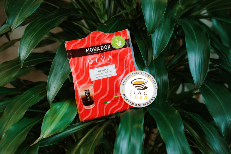 Diva Sophia compostable coffee pod packaging on a green leafy background with platinum award